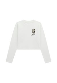 Witte lange mouwen cropped t-shirt met een zwart-wit versierd logo "G" en "Guess" in een sierlijk lettertype onder het logo. Glad van stof.