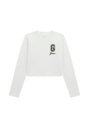 T-shirt cropped a maniche lunghe bianca con logo in bianco e nero decorato "G" e "Guess" in corsivo sotto il logo. Tessuto liscio.
