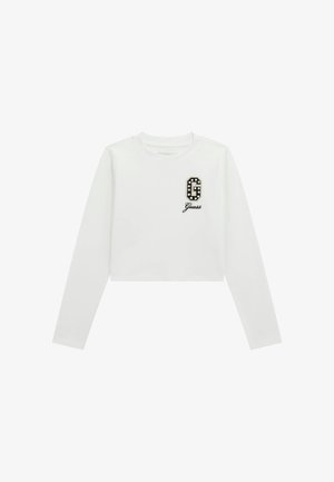 Vit långärmad croppad t-shirt med ett svart och vitt utsmyckat logo "G" och "Guess" i skrivstil under logot. Slät textur.