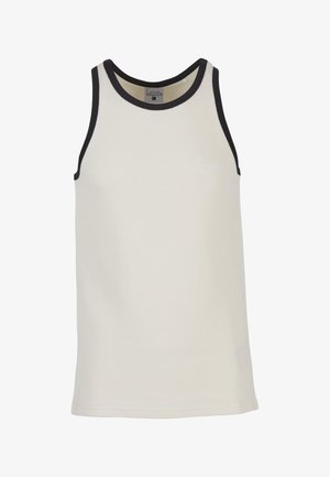 Ujjatlan bézs tank top fekete szegéllyel a nyaknál és a karöltőknél, bordázott textúrával és egy kis, diszkrét logóval a bal mellkason.