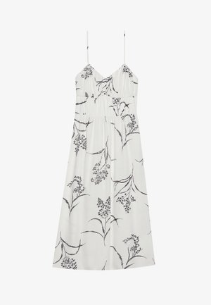 Balta gėlių suknelė su plonomis petnešėlėmis, su juodais botaniniais raštais, raukšlėta krūtine ir laisvu siluetu, pagaminta iš lengvos medžiagos.