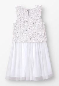 Witte jurk met een pailletten bovenstuk met glanzende accenten en een doorschijnende tule rok. Sleutelgat sluiting aan de achterkant. Gladde stoffen textuur.