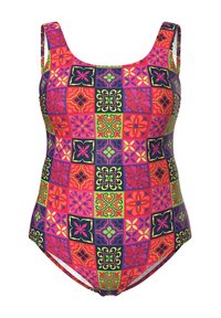 Kaupunki-puku, jossa on eläväinen päällekkäin sovitettu kuviointi, joka sisältää kukkakuvioita ja geometrisia muotoja pinkissä, vihreässä, purppurassa ja mustassa. Säädettävät hihnat.