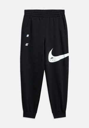 Schwarze Nike-Sweathose mit elastischem Bund, seitlichen Taschen und großem weißem Nike-Swoosh sowie Logo auf der Vorderseite.