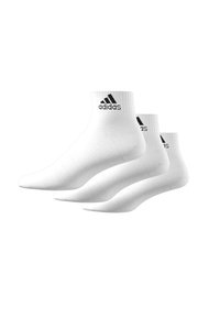 White ankle socks made of cotton blend, featuring a ribbed design and black Adidas logo at the top. Pack of three pairs.