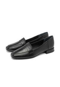 Mustat nahkaiset loaferit teräväkärkisellä muotoilulla, koristeellinen nauha yläosassa ja matala tukkikorko. Sujuva pinta, jossa on vähäistä ompeluyksityiskohtaa.