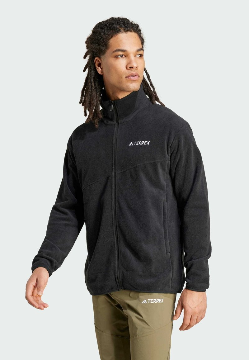 Black fleece jacket with a high collar, zip front, and subtle Terrex logo; features a smooth texture and two side pockets.