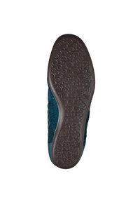 Sko sula med texturerat brunt gummi, med ett cirkulärt mönster. Ovandel i mörk teal tyg med en smidig övergång till en gummihäl.