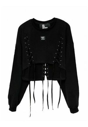 Sudadera negra corta con mangas largas, con detalles de lazada lateral en cuerda negra y un escote redondo. Tejido texturizado con etiqueta.