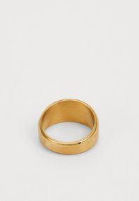 Gold ring with a smooth, polished finish. It features a rounded, slightly domed shape and a subtle groove detail along the outer edge.