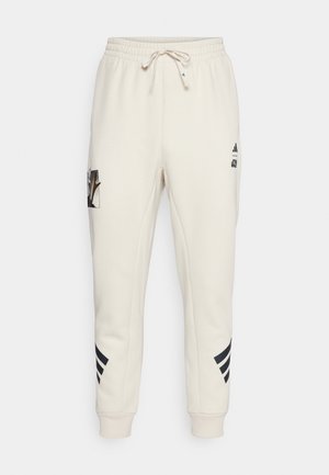 adidas Sportswear STAR WARS THE MANDALORIAN™ - Tracksuit bottoms - clear brown