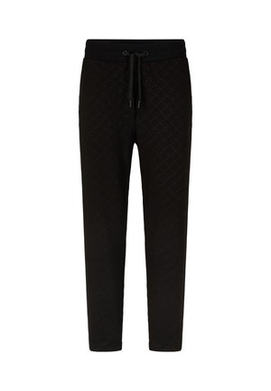 Schwarze Sweatpants mit einem strukturierten Muster, ausgestattet mit einem elastischen Bund und einer Kordel, schmal zulaufenden Beinen und ohne sichtbare Taschen.