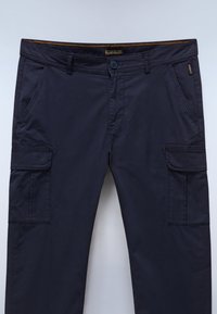 Navy cargo pants made of lightweight fabric, featuring two side pockets, two cargo pockets, and a button closure with a zip fly.