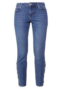Jeans skinny de denim azul con cintura alta, cinco bolsillos y botones decorativos a lo largo de las costuras laterales. Textura suave con un ligero desvanecimiento.