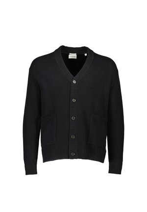 Svart stickad kavaj med V-hals, ribbade ärmsluttningar och fåll. Har sex knappar framtill och två påsydda fickor. Slät textur.