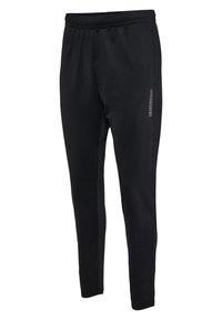 Black athletic pants with a tapered fit, elastic waistband, smooth texture, and a logo detail along the side. Designed for comfort and mobility.