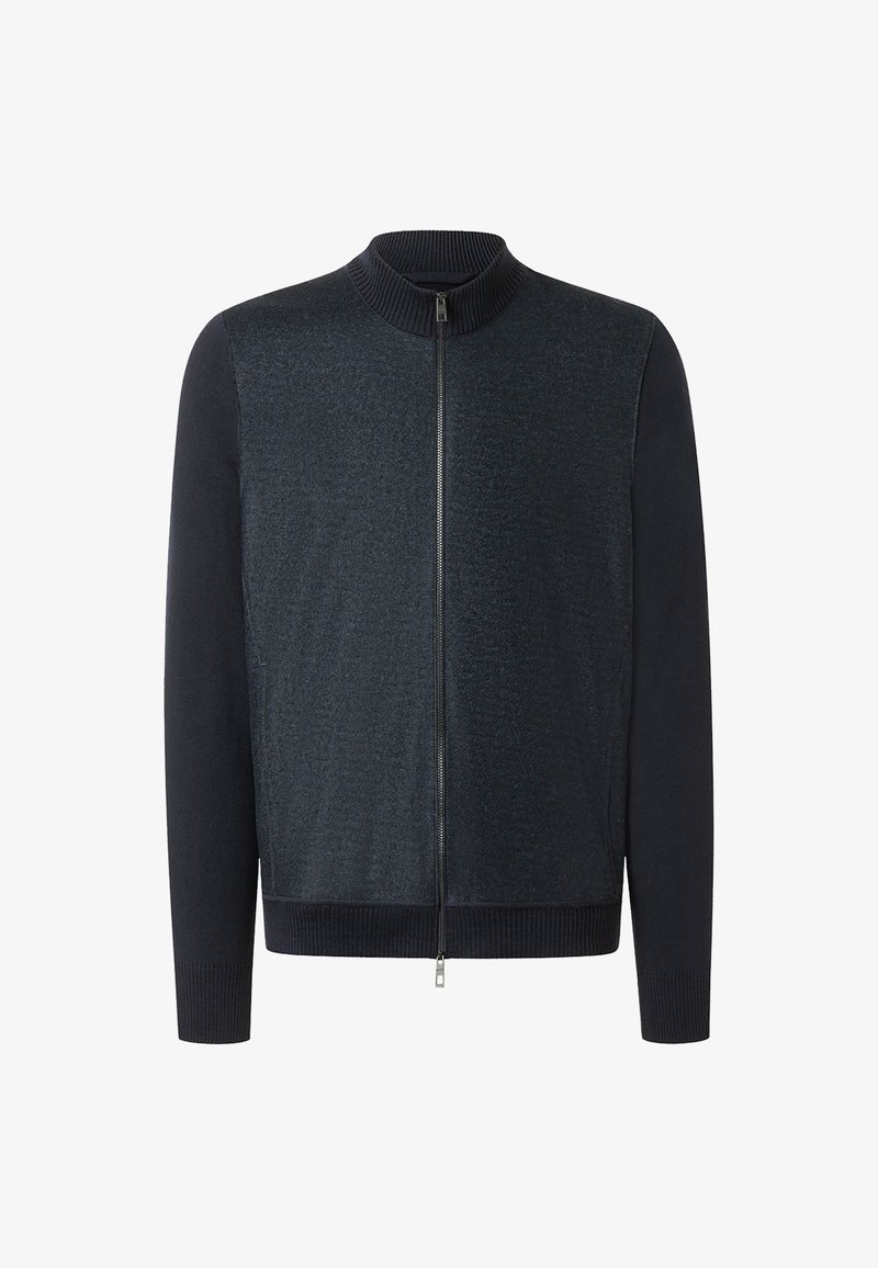 Marinblå zip-jacka med texturerad kropp och släta ärmar, med ståkrage samt ribbade mudd och nederkant.