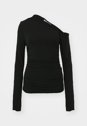Top negro de manga larga con diseño de un solo hombro y detalles fruncidos en el lateral; fabricado con una tela suave y elástica.