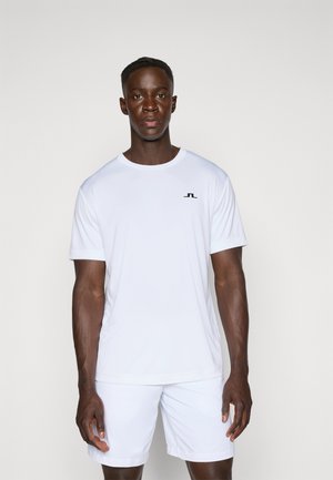 White athletic t-shirt with short sleeves and a round neckline. Features a small black logo on the chest. Smooth, lightweight fabric.