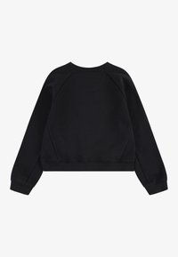 Felpa nera corta con scollatura rotonda e maniche raglan. Tessuto morbido con polsini e orlo a costine, senza motivi o logo visibili.