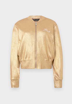 Goldene metallische Bomberjacke mit Frontreißverschluss, gerippten Bündchen und Saum, seitlichen Taschen und "Karl"-Stickerei auf der linken Brust.