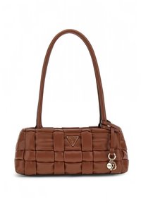 Brown quilted handbag with stylized triangular logo, dual handles, and charm accents. Made from leather with smooth texture.