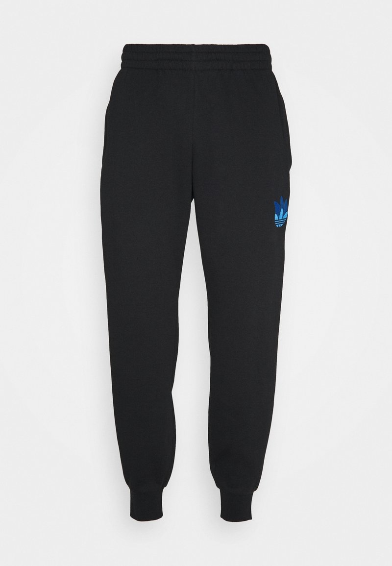Svarta sweatpants med elastisk midja och ribbade ärmar. Har en blå Adidas-logga på vänster lår. Tillverkad av mjukt tyg.