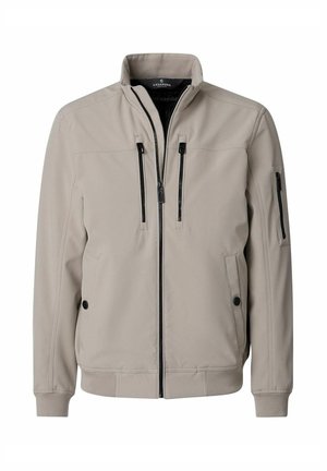 Lichtbeige jas met ritssluiting en opstaande kraag, twee verticale borstzakken met rits, twee zijzakken met knopen en één ritssluitingzak op de linker mouw.