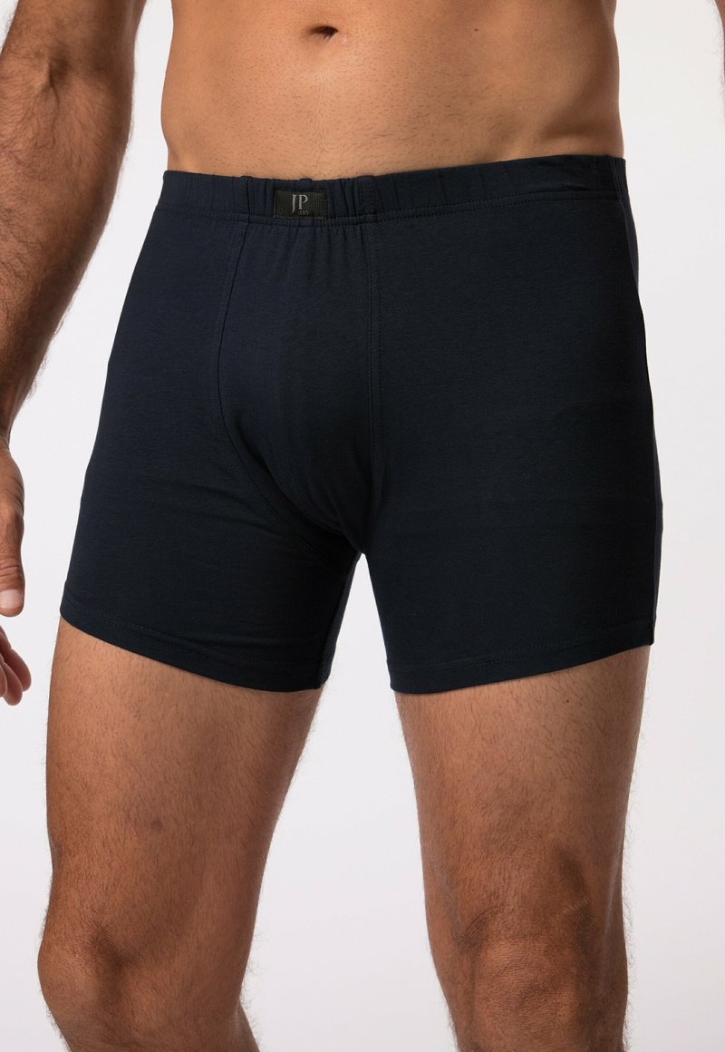 Boxer-briefs en coton noir avec une taille élastique arborant un logo, coupe ajustée, texture lisse et couleur unie sans motifs.
