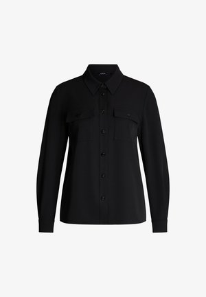 Black button-up shirt made from smooth fabric, featuring a classic collar, two chest pockets, and long sleeves with cuff detailing.