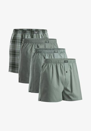 Vier paar herenboxershorts in groen tinten. De patronen omvatten ruitjes, strepen en effen. Ze zijn voorzien van elastische taillebanden en een knoopgulp.