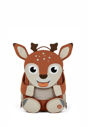 Brown and beige children's backpack shaped like a smiling deer with large eyes, ears, antlers, and paws on a white background.