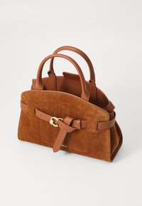 Brown suede handbag with leather accents, featuring short handles, a structured shape, and a decorative buckle strap. Gold hardware detail.
