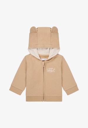 Tan Zip-Hoodie mit Bärenohren, weicher Innenfutter, gerippten Bündchen und Kängurutaschen. Mit dem Schriftzug "Du bist so süß".