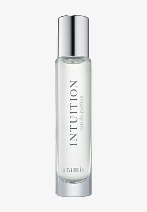 Klar glassflaske med "INTUITION" eau de parfum med en sølvkapp, med minimalistisk tekst i elegant skrifttype. Glatt, sylinderformet design.