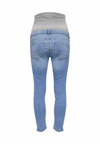 Jeans ajustados azules con una alta cinturilla elástica gris. Presentan dos bolsillos traseros y una textura de mezclilla suave.