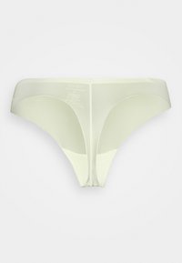 Fio dental verde claro, com um tecido suave e elástico, com costuras mínimas e uma cintura estreita. Sem padrões ou acentos visíveis.