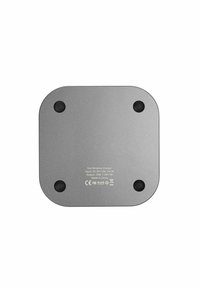 Square fast wireless charger in metallic gray, with a smooth surface, four rubber feet for stability, and printed input/output specifications.