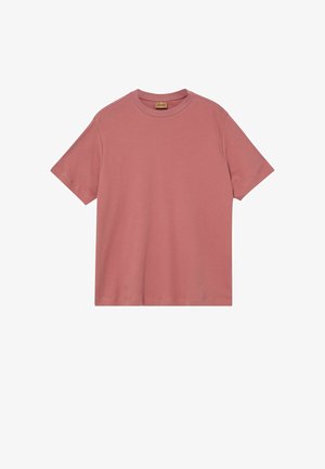 Camiseta de algodón color rosa polvo con cuello redondo y mangas cortas, dobladillo recto, mostrada plana sobre un fondo blanco.