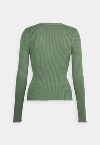 Long-sleeve, ribbed top in olive green. Features a fitted silhouette and a subtle crew neckline, made from a stretchy knit material.