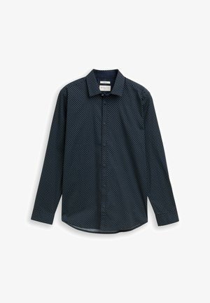 Tumesinine pika varrukaga nööbitav särk, millel on väike valge teemantmuster, terav krae ja ümar ääreosa, ripub tasaselt valgel taustal.