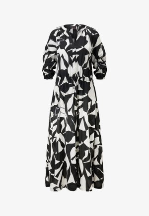 Schwarz-weiß gemustertes Kleid mit langen Ärmeln, V-Ausschnitt und elastischem Bund. Fließender, leichter Stoff mit abstrakten Formen.