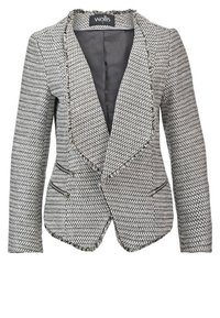 Blazer texturé gris et blanc pour femme avec larges revers, deux poches horizontales zippées et doublure intérieure noire.