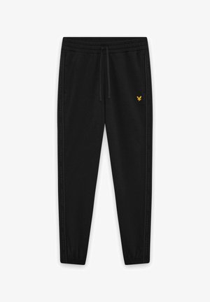 Zwarte joggingsbroek met elastische boorden, taille met trekkoord, zijstrepen met tekst en een klein geel vogel logo op de linker dij.