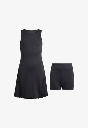 Čierne športové šaty s bezrukávovým dizajnom, s bočnými rozparkami. Obsahuje zodpovedajúce čierne šortky s priliehavým strihom.