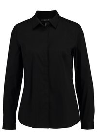 Chemise noire à manches longues avec un col pointu. En tissu lisse, dotée d'une fermeture à boutons sur le devant et de deux poches latérales.