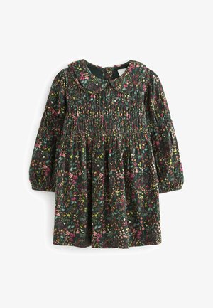 Robe d'enfant à manches longues vert foncé avec smocks, motif floral rose, jaune et orange, et col rond style Peter Pan.