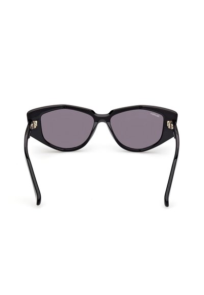 Schwarze Cat-Eye-Sonnenbrillen mit dunkel getönten Gläsern, geometrischem Design und goldenen Metallakzenten an den Seiten. Glatter Plastikrahmen.