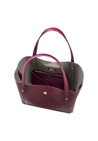Leather tote bag in deep burgundy with gray interior, featuring two handles, gold hardware, and a zippered inner pouch. Smooth texture.