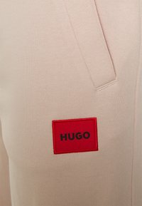 HUGO DOAK - Calças de fato de treino - light/pastel pink